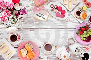 Mothers Day tea frame over a white wood background