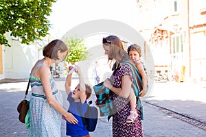 Mothers spending time outdoors, warm summer day