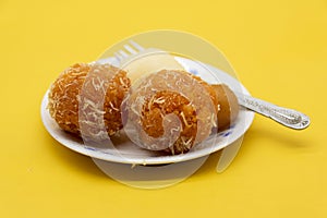 motichoor laddoo also know as bundi laddu over on white background photo