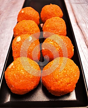 Motichoor-Ladoo dessert sweet-food Indian-food Indian-culture mithai snack hinduism plate sugar-food tradition orange-color