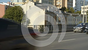 Motion along bridge with driving automobiles in city