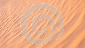 Motion blur abstract of golden desert sand texture as background