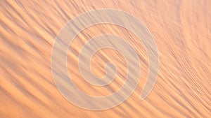 Motion blur abstract of golden desert sand texture as background