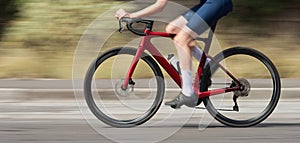 Motion blur of a bike race with the bicycle and rider at high speed