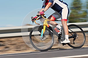 Motion blur of a bike race with the bicycle and rider at high speed