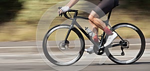 Motion blur of a bike race with the bicycle and rider at high speed