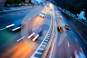 Motion blur car viewed from the road bridge in big modern city