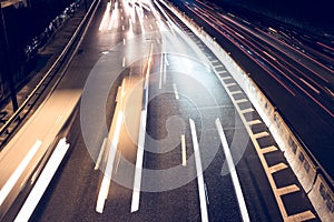 Motion blur car viewed from the road bridge in big modern city