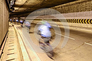 Motion blur of cyclist in underground road