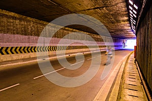 Motion blur of cyclist in underground road