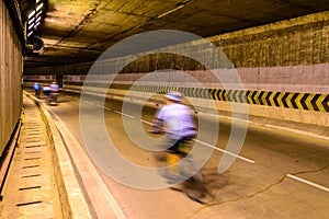 Motion blur of cyclist in underground road