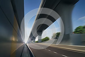 Motion blur empty highway asphalt road and overpass