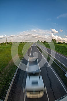 Motion blur image of a car moving along the highway