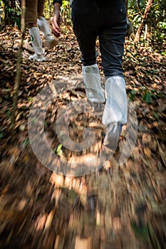 Motion blur of legs covered by white long socks