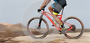 Motion blur of a mountain bike race with the bicycle and rider at high speed