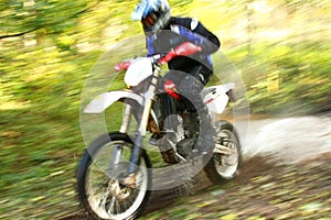 Motion blur, offroad motorbike crossing river
