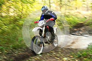 Motion blur, offroad motorbike crossing river photo