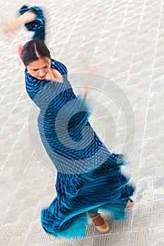 Motion Blur Shot of Traditional Woman Spanish Flamenco Dancer