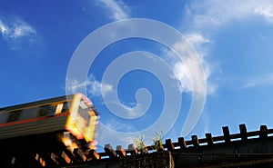 Motion blur train in the blue sky