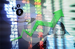 Motion blur of up trend arrow line chart with trader and computer in the marketing room on blurred stock board background in busin