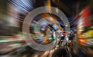 Motion blurred abstract lights of a nighttime street scene in Chinatown, New York City