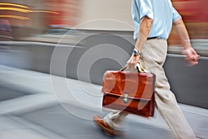 Motion blurred business people walking on the street