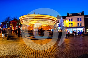 Motion blurred carousel at night in Waterford, Ireland