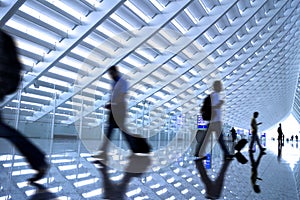 Motion blurred commuters At the airport