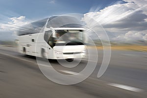 Motion blurred image of driving bus