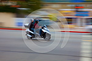 Motion Blurred moped photo