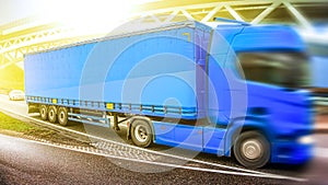 Motion blurred trucks on highway. Transportation