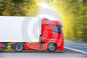 Motion blurred trucks on highway. Transportation