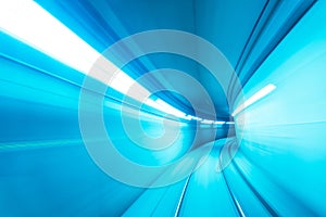 Motion blurred underground subway tunnel