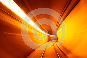 Motion blurred underground subway tunnel