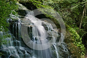 Motion blurred water cascading down Soco Waterfall in North Carolina