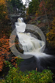 Motion-blurred water of Raymondskill Falls in Autumn