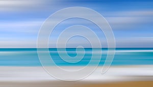 A motion blurry image of a beach with a blue sky in the background.