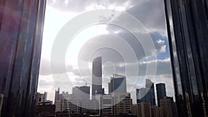 Motion Lapse (time-lapse) of modern city Downtown Abu Dhabi landmarks and World Trade Center Towers on a cloudy day