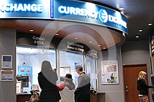 Motion of passengers at foreign currency exchange place inside YVR airport