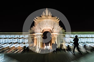 Motion photography and blur of the rua arch in Lisbon, Portugal at night photo