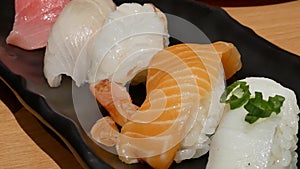 Motion of roll salmon sashimi on table