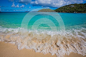 Motion waves break on the shore on Hawksnest beach in St. John photo