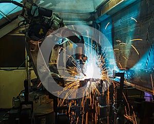 Motion Welding robots in a car factory