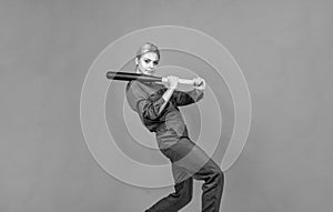 in motion. woman in boilersuit with bat. female baseball player. sports and games.