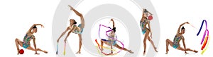 In motion. Young female rhythmic gymnast training isolated over white background. Flyer