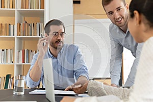 Motivated colleagues discuss business ideas at meeting