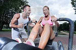 Motivated couple on the outdoor gym