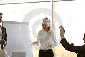 Motivated employee raise hand interacting with coach