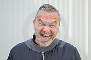 Motivated excited middle-aged man giving a thumbs up