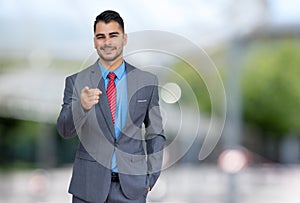 Motivated latin american businessman in suit and tie